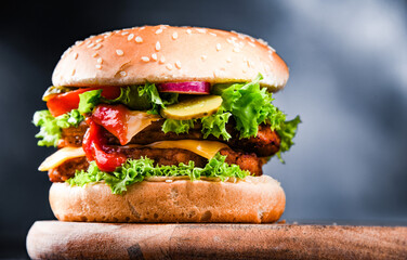 Hamburger with cheese and fresh vegetables