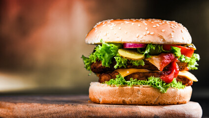 Hamburger with cheese and fresh vegetables