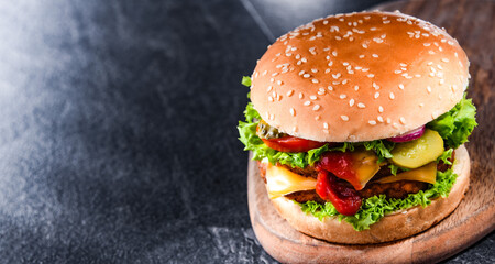Hamburger with cheese and fresh vegetables