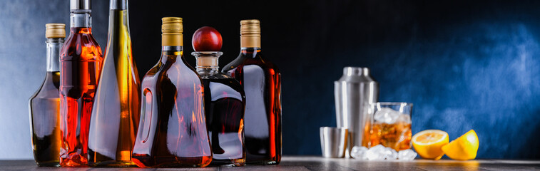 Bottles of assorted alcoholic beverages and bartender