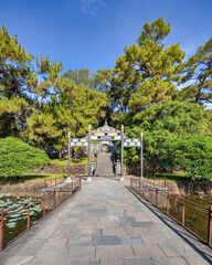 Minh Mang tomb near the Imperial City with the Purple Forbidden City within the Citadel in Hue, Vietnam. Imperial Royal Palace of Nguyen dynasty in Hue. Hue is a popular 
