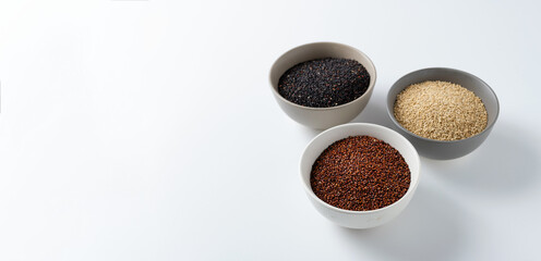 quinoa grain cereal, pseudo-grain, different types and colors, white, black, red quinoa on a white background, banner