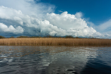 cloudy landscape in the lake and the sea with kayaks