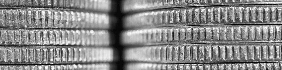 Stacks of US American coins of 25 cents quarters closeup. Black and white banner about economy finance banks in the United States. Old money headline. Macro