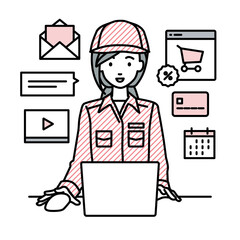 デスクで座ってPCでネットショップやマーケティングの仕事をしている作業員の女性