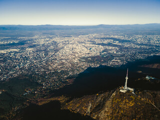 Aerial Autumn view of Kopititoto tower, Vitosha Mountain and city of Sofia, Bulgaria. Stunning drone shot. Blue skies. High quality photo