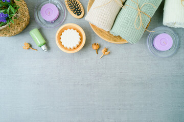 Spa product composition over gray background. Beauty treatment concept. Flat lay, top view