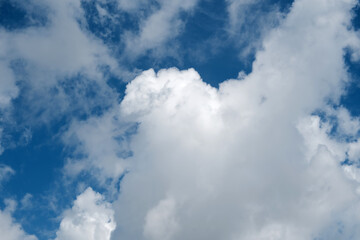 Background of a blue sky with fluffy clouds