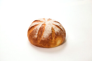 Loaf of fresh backed round white russian bread