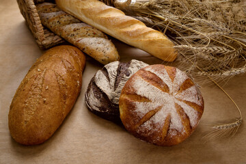 Bread different types white bread black bread still life basket with spikelets of wheat