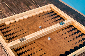 Dice on the backgammon board on the background.