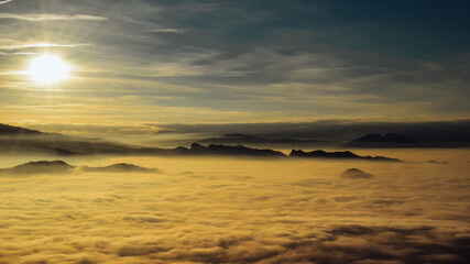 San marino over the clouds at sunset 