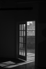 Door and doorway into light filled room in an urban downtown setting