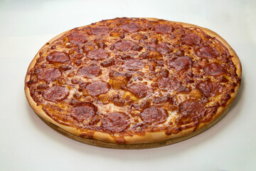 Fresh baked tasty pizza with pepperoni and cheese