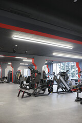 Muscle trainers in the gym Stylish room