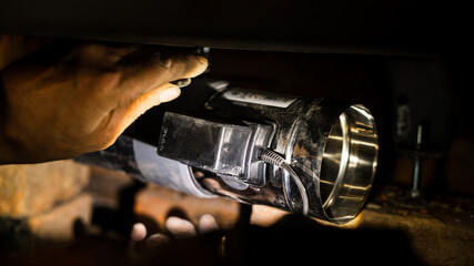 Installation of an automatic gate in a fireplace with a water contour.