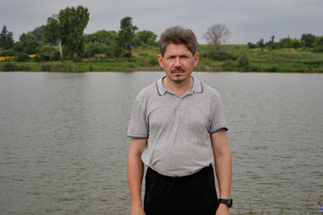 Fototapeta premium Fishing on the lake. Photo before going home. Recreation center. August 2021.