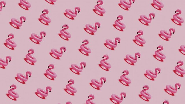 3d pastel pink background with fun flamingo float pattern, rotating. Summer, tropical vibes, exotic vacation concept. Top view 3d abstract. Render loop animation 