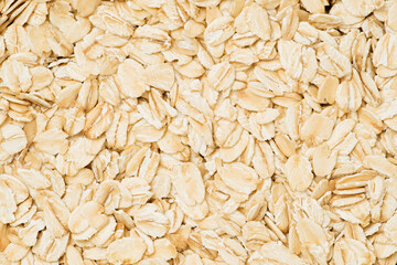 Rolled oat, oat flakes background or texture. Close up, top view    