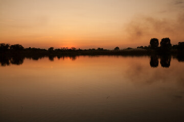 Silhouette of sunrise or sunset over the lake