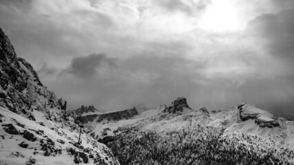 Stormy clouds in italian dolomites in a snowy winter