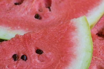 Watermelon sliced into beautiful pieces close-up copy space