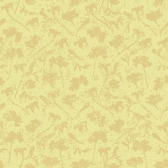 Vintage abstract floral seamless vector pattern with grunge effect. Loosely scattered scratched fading floral silhouettes in soft yellow for wallpaper, curtains, upholstery and fashion fabrics.