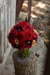 Wedding bouquet . The bride's bouquet. Bouquet of red flowers. Bridal douquet composed of dahlia and roses.