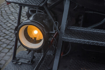 an old lighted bulb on a steam locomotive