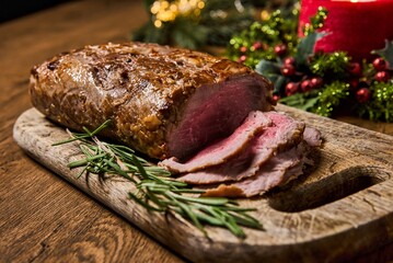 Sliced Baked roast meat, isolated on wooden background. High quality photo