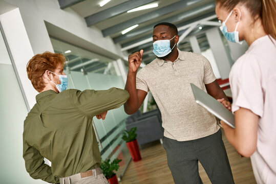 Men Elbow Bumping While Meet After Coronavirus