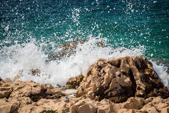 Big wave on beach with stones in Makarska. Makarska is the center of the Makarska Riviera, a popular tourist destination in Central Dalmatia in Croatia
