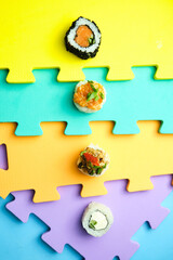 sushi rolls on a color background, minimalism