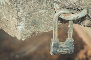 Padlock with the initials of a couple in love. A symbol of love. Old padlock. Russian text - Y plus...