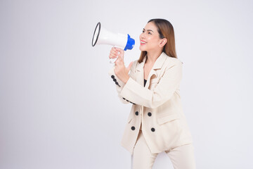 portrait of young beautiful smiling woman in suit using megaphone to announce over isolated white background studio..