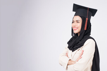 Young muslim woman graduated over white background studio..