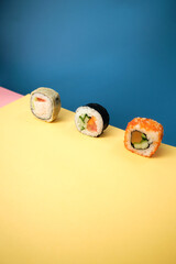 sushi rolls on a color background, minimalism