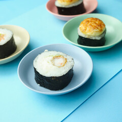 sushi rolls on a color background, minimalism