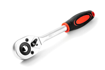 Metal wrench with replaceable attachments and a ratchet with a plastic handle. Close-up isolated on...