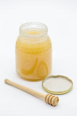 honey jar and wooden honey spoon