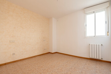 Empty room with white painted walls and another draped in cream and red with aluminum radiator