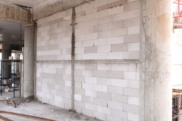 Aerated bricks in construction. The walls are made of lightweight bricks. The walls of most buildings use economical and economical materials.