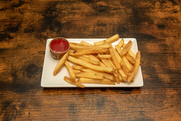 portion of homemade chips with ketchup sauce