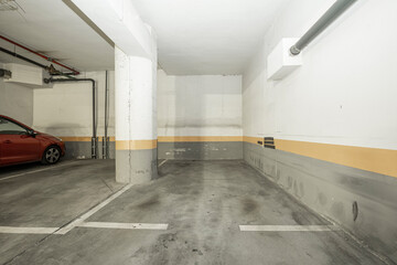 Garage with concrete track in residential apartment building