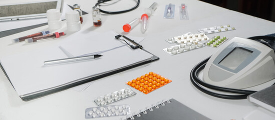 Medicine, doctor sitting at the table and writing a prescription to the patient, remote visit, online treatment, top view, medical background,