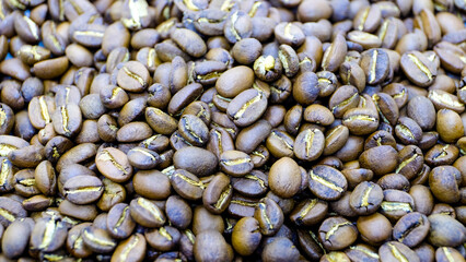 Roasted coffee beans. Detailed macro and closeup shot for backgrounds and texture. 