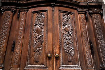 Historical wooden gate of Frauenkirche with rich carving ornaments, Munich, Germany