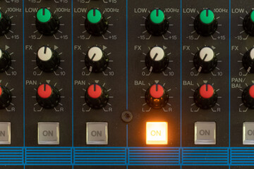 sound mixer control panel, set of knobs, buttons and sliders. audio mixer, music equipment.