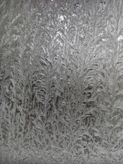 Icy frost patterns on the glass. Severe frost.