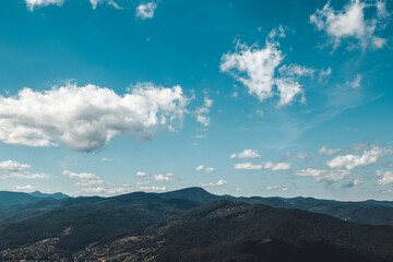 Summer landscape in mountains and the dark blue sky with clouds - 479220024